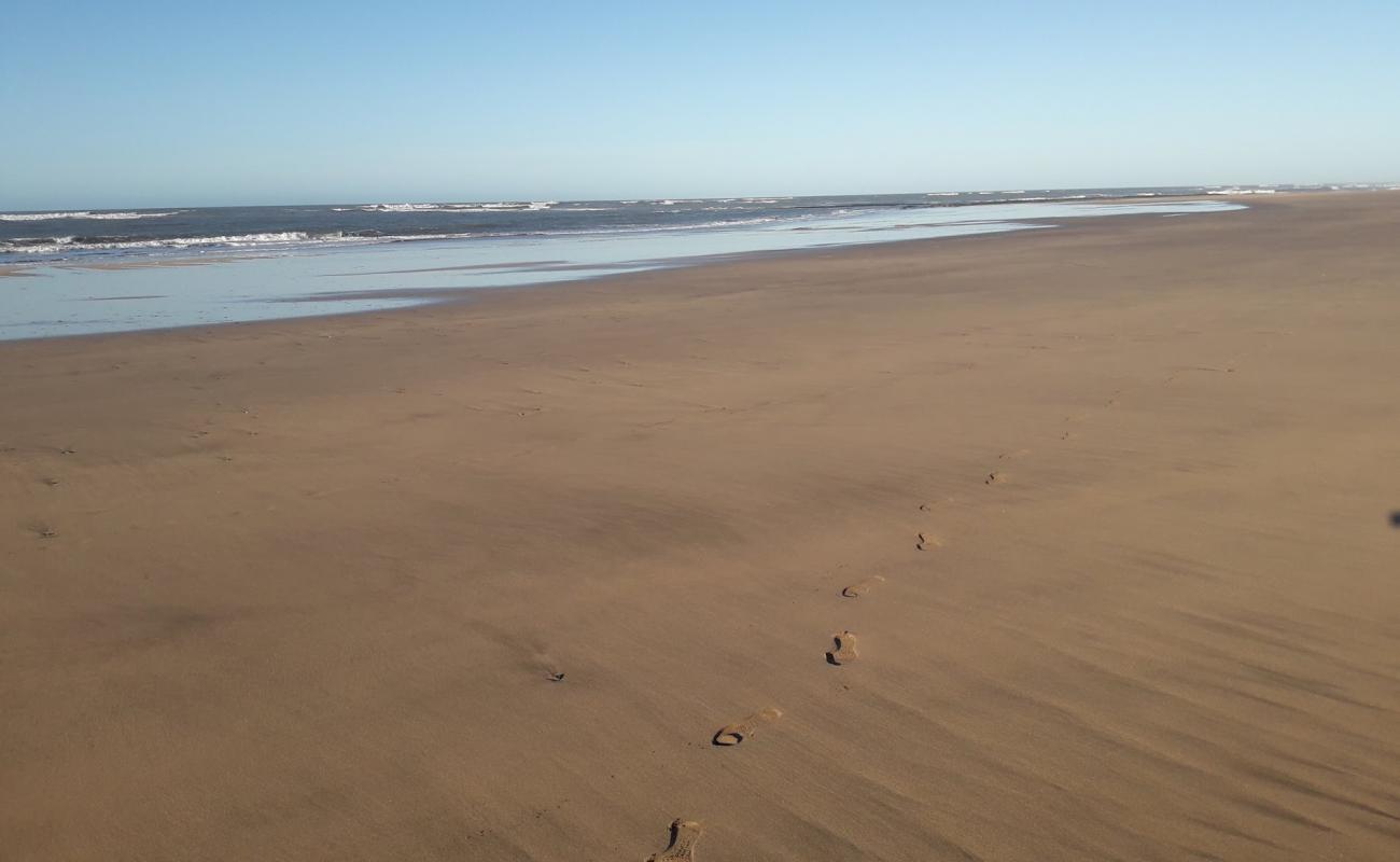 Photo de Plage Half Moon avec sable fin et lumineux de surface