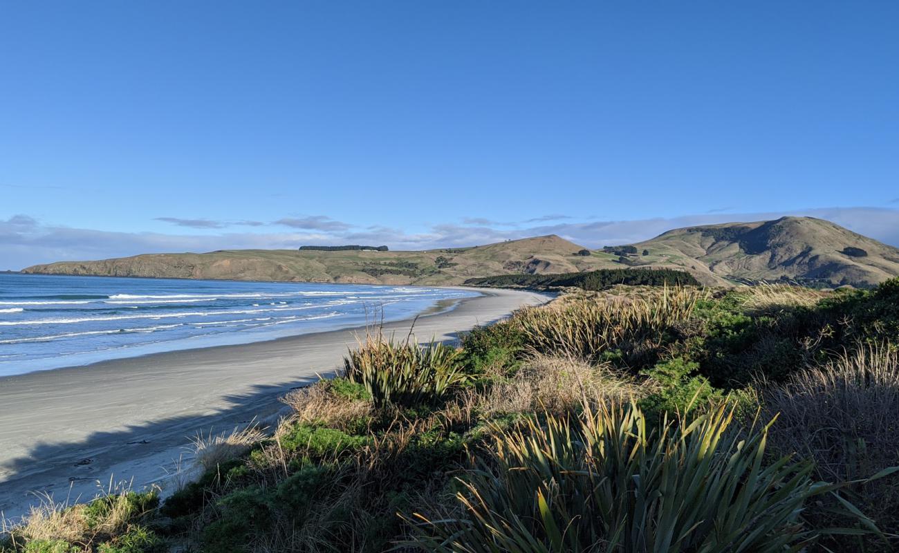 Photo de Victory Beach avec sable beige de surface