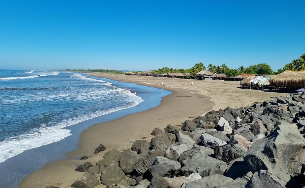 Photo de Corinto beach avec sable gris de surface