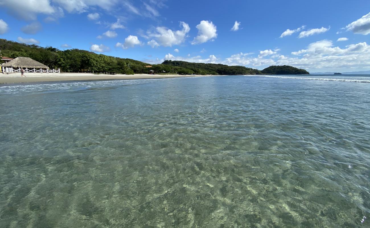 Photo de La plage El Coco avec sable beige de surface