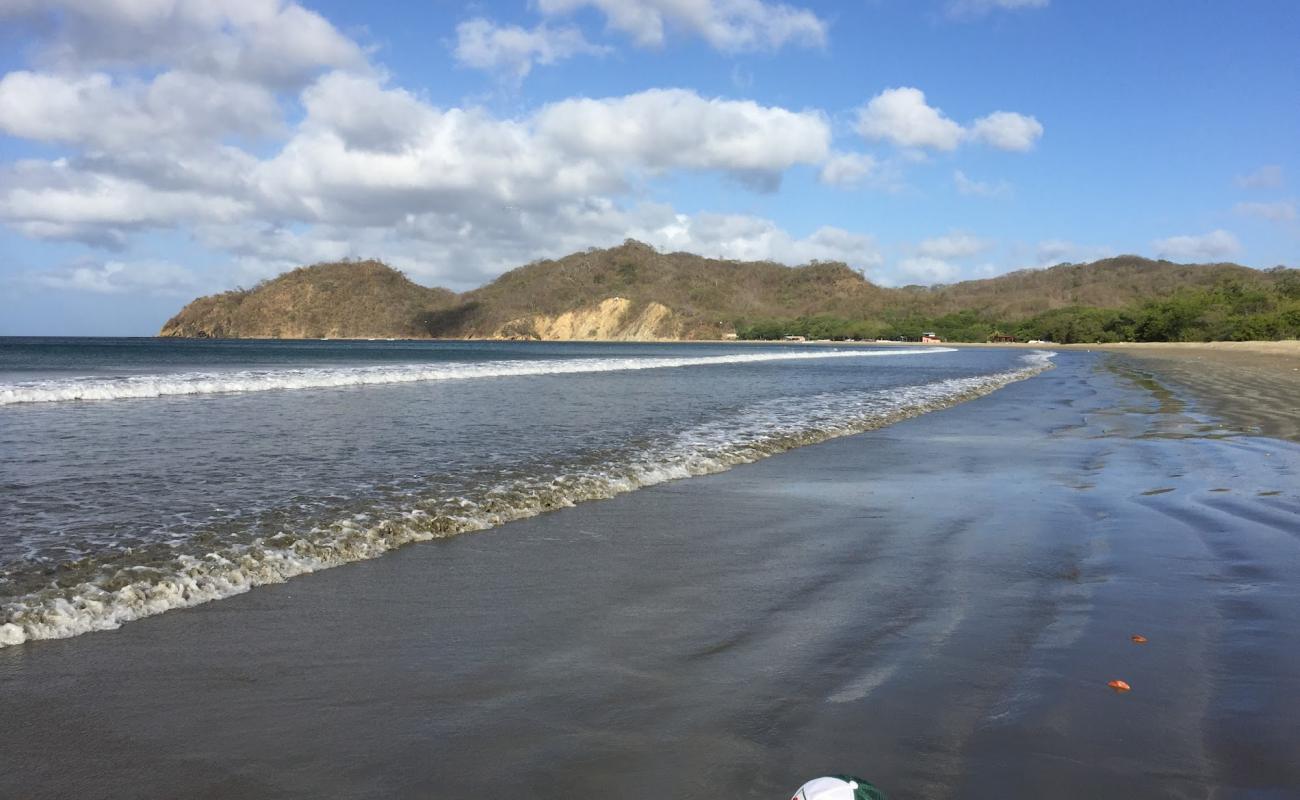 Photo de La plage d'Ostional avec caillou fin clair de surface