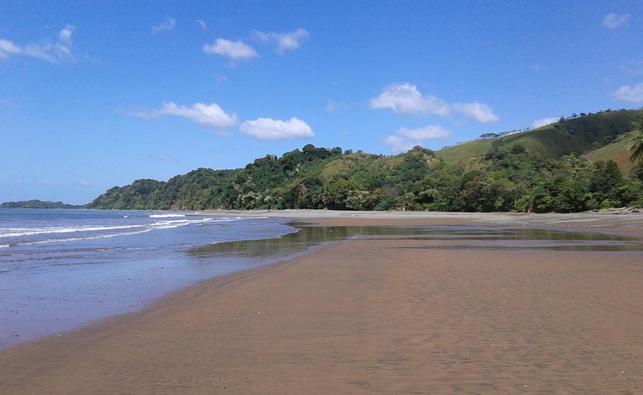 Photo de Malena Beach avec sable brun de surface