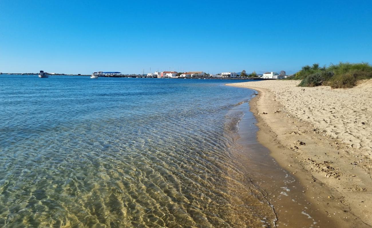 Photo de Praia dos Tesos avec sable lumineux de surface