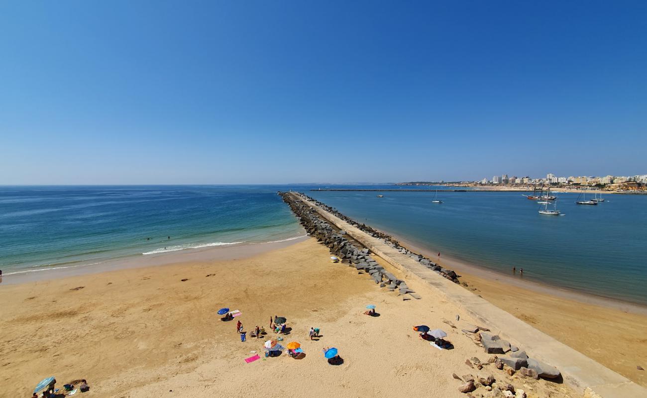 Photo de Praia do Molhe avec sable lumineux de surface