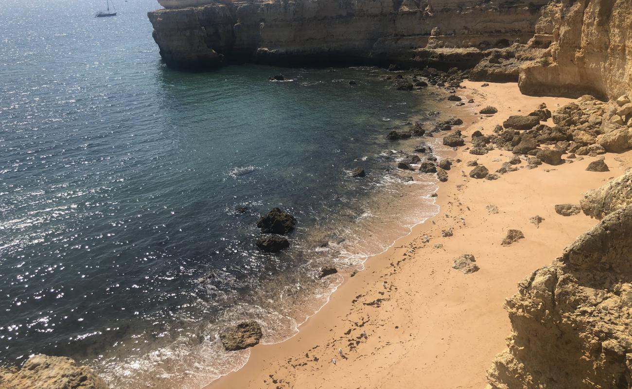 Photo de Praia da Ponta Pequena avec sable lumineux de surface