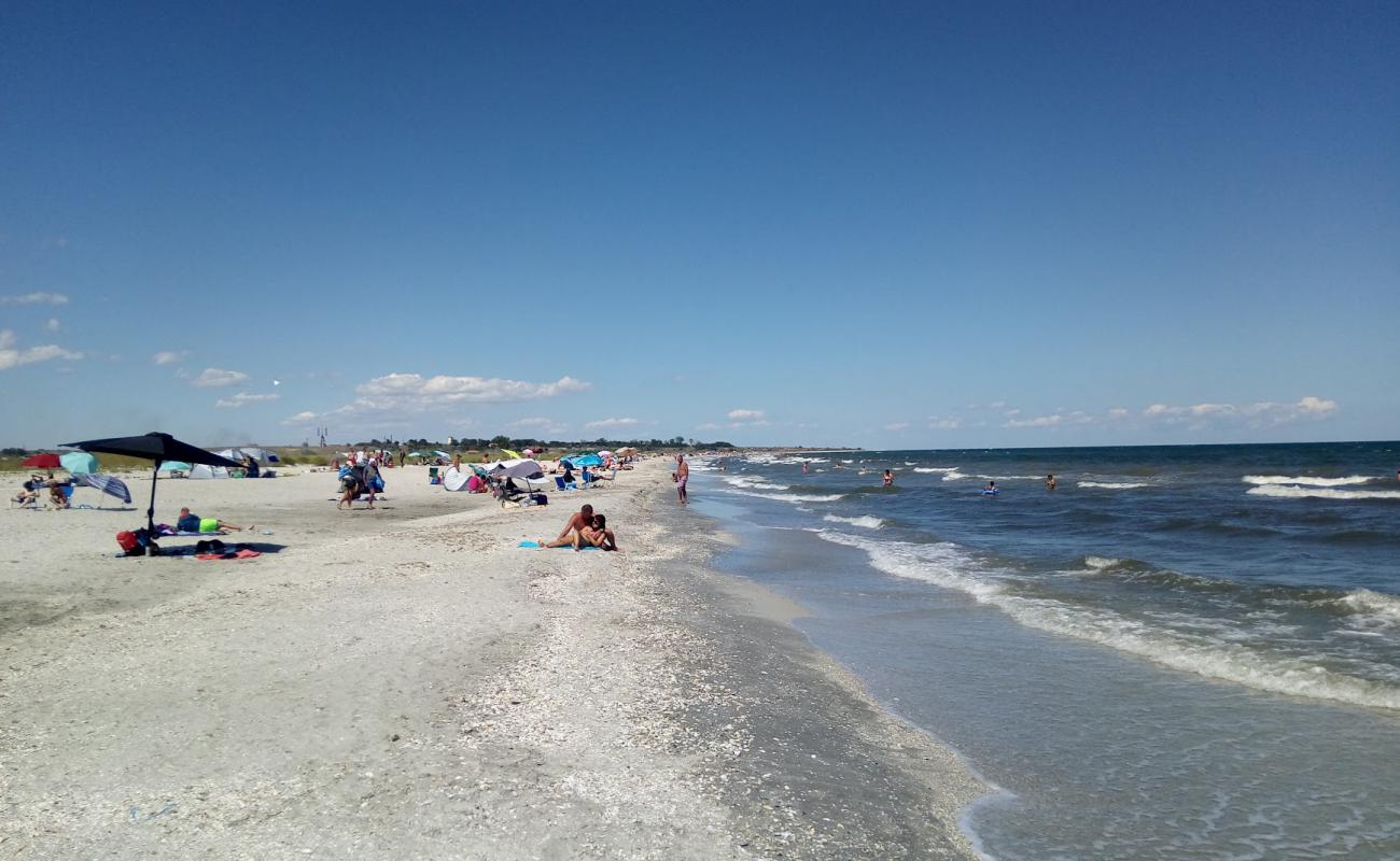 Photo de Corbu beach avec sable lumineux de surface