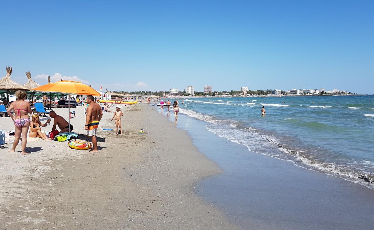 Photo de Reef beach avec sable gris de surface