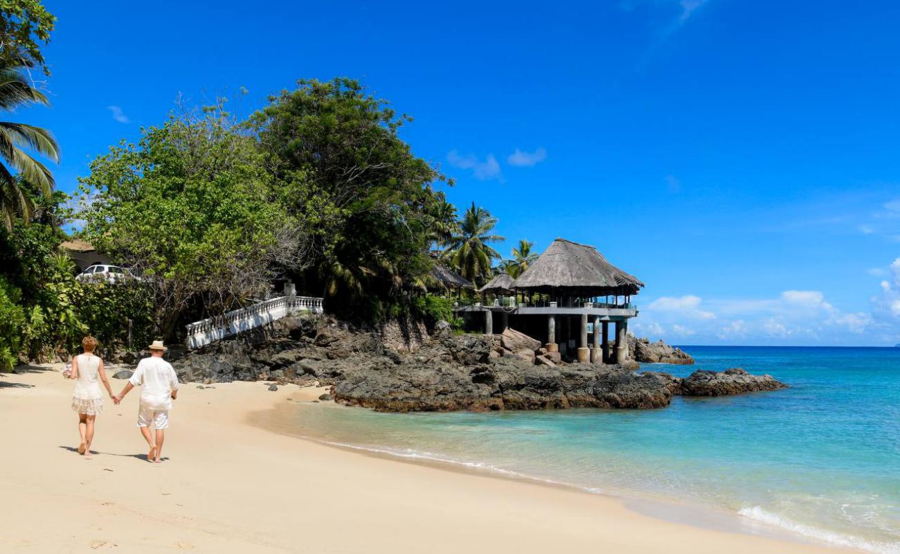 Photo de Sunset Beach avec sable beige fin de surface