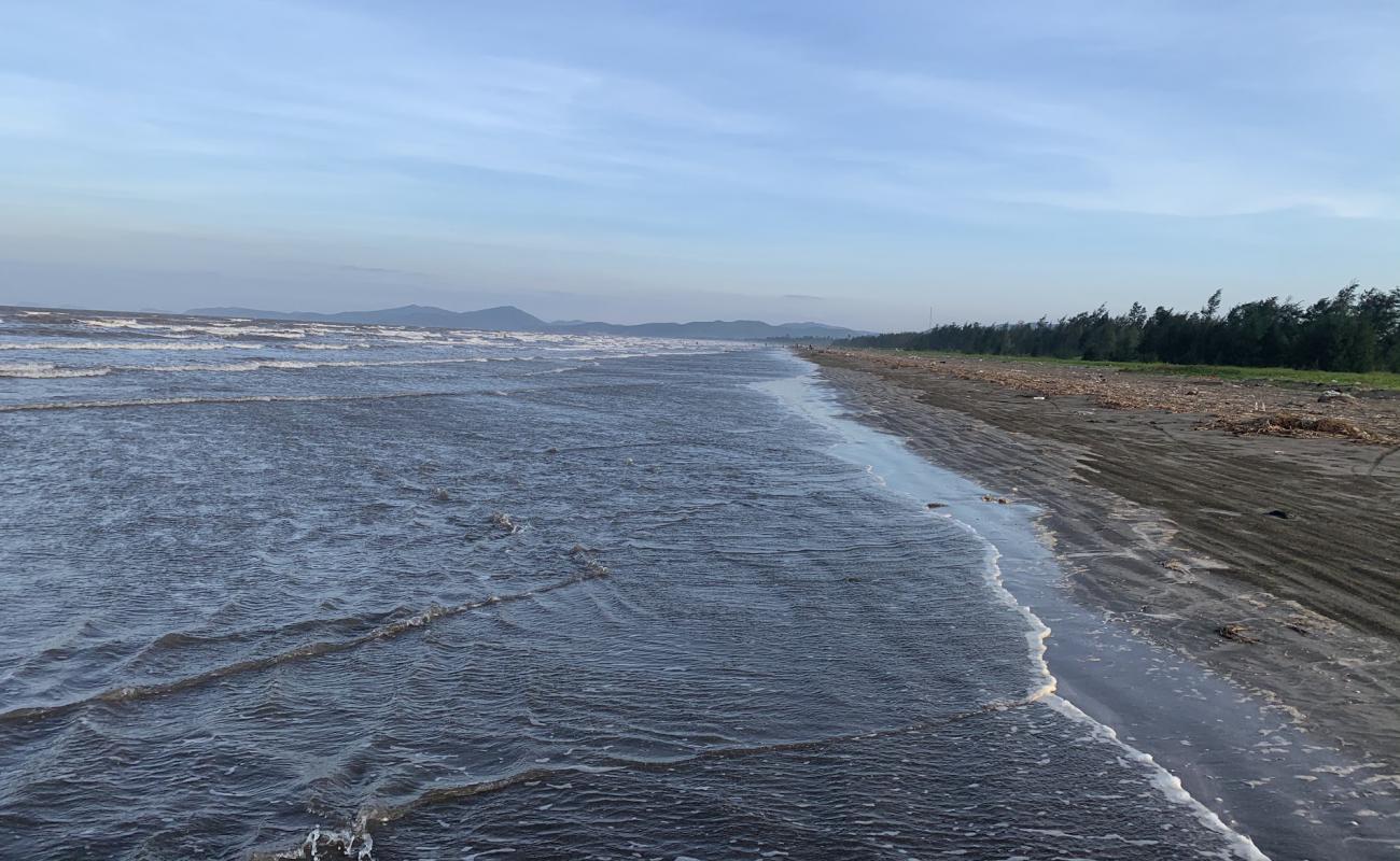 Photo de Dien Thanh Beach avec sable brun de surface