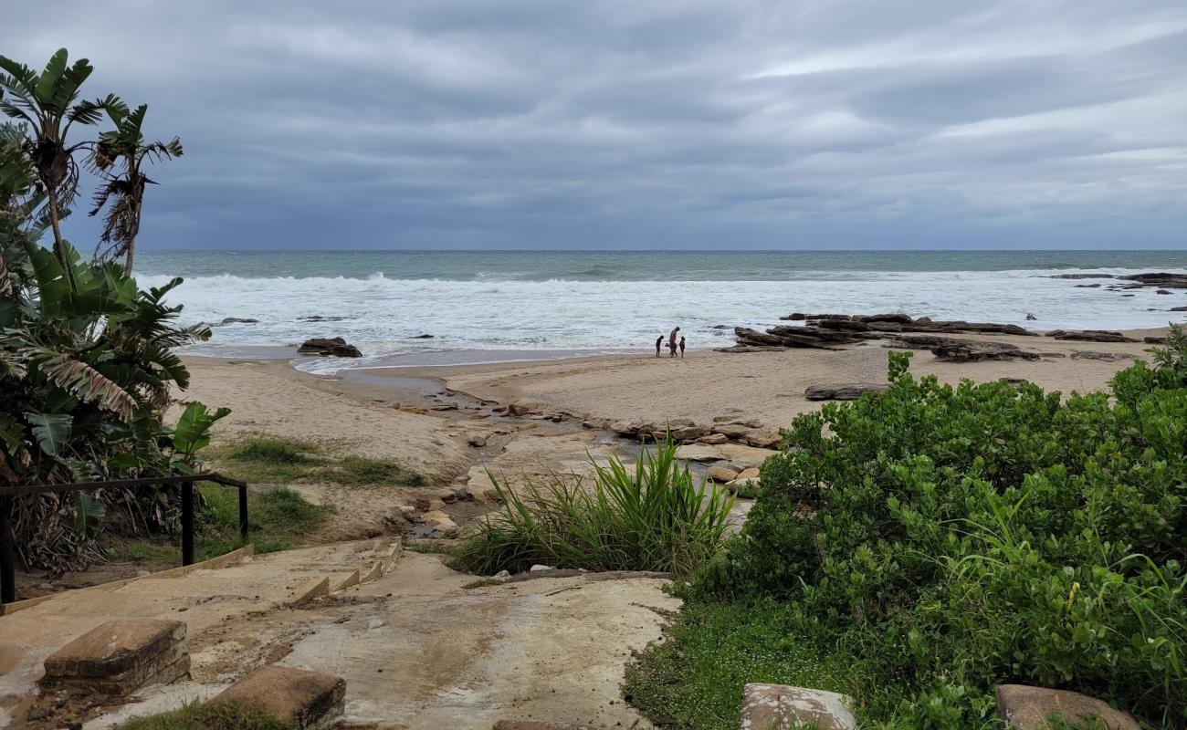 Photo de Dassie beach avec sable beige & pierres de surface