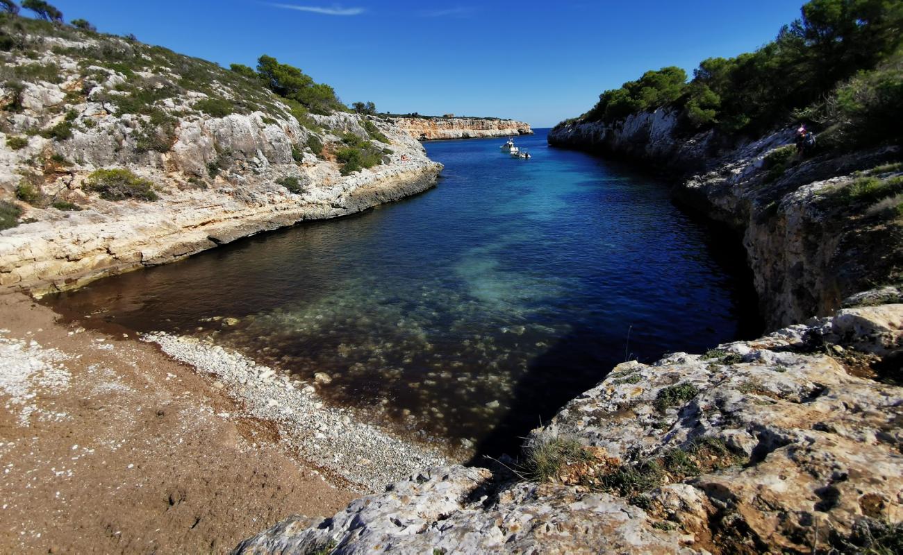 Photo de Cala Pilota avec sable beige & pierres de surface