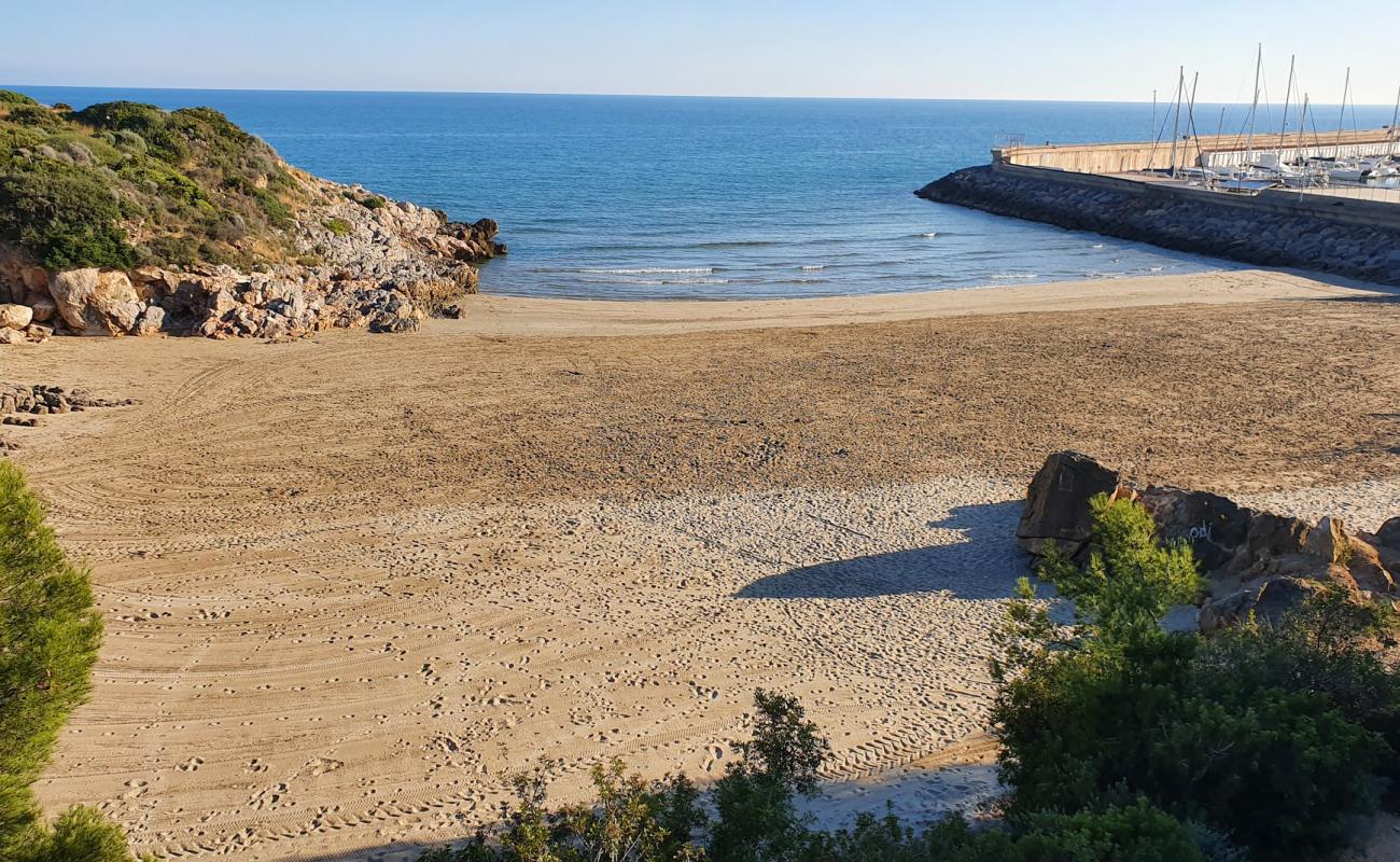 Photo de Cala el Retor avec sable brun de surface