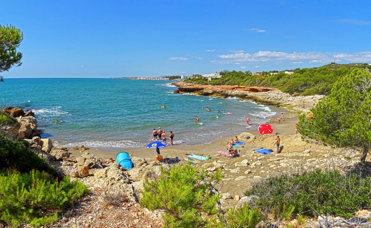 Photo de Cala Blanca avec sable brun de surface