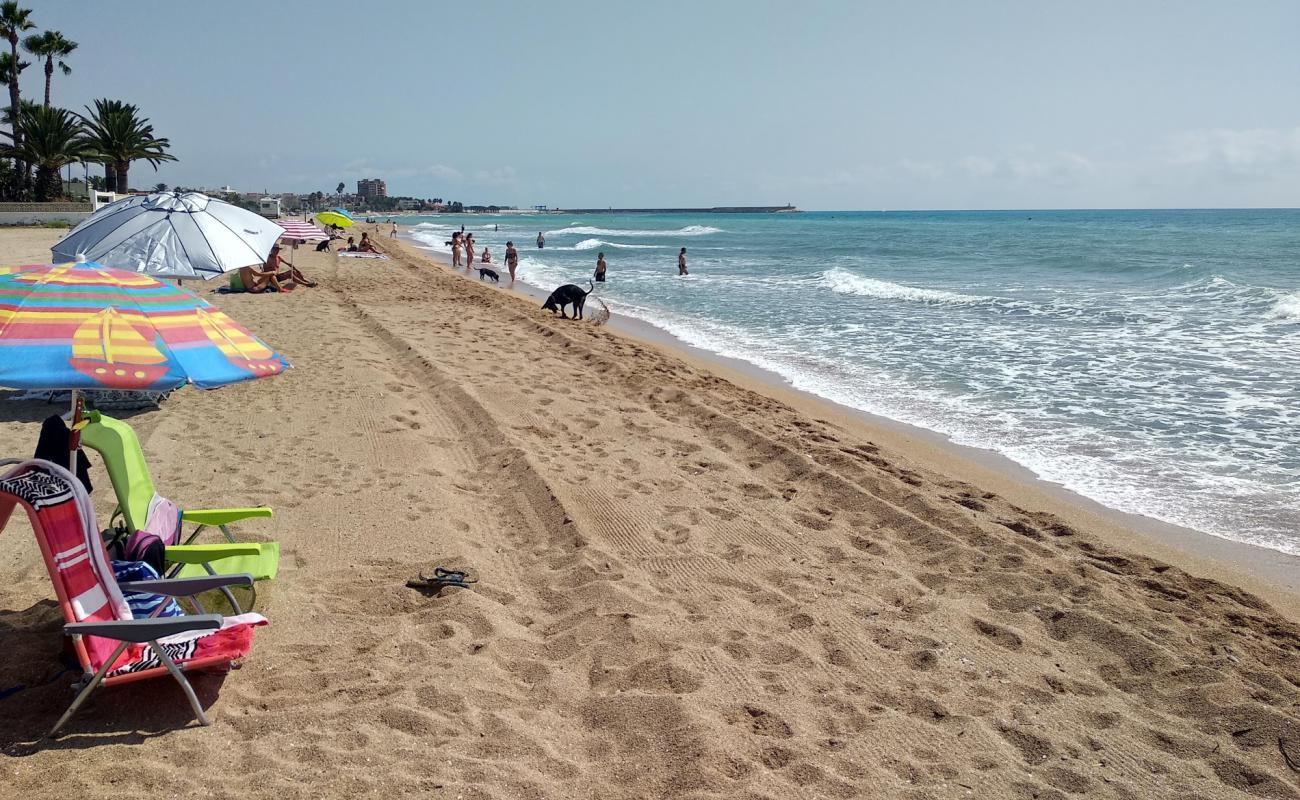 Photo de Platja del Morrongo avec sable brun de surface