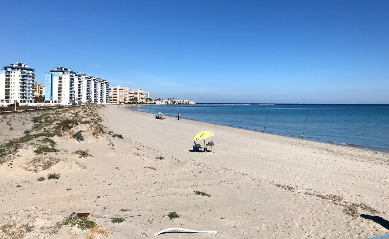 Photo de Playa del Pudrimel avec sable beige de surface