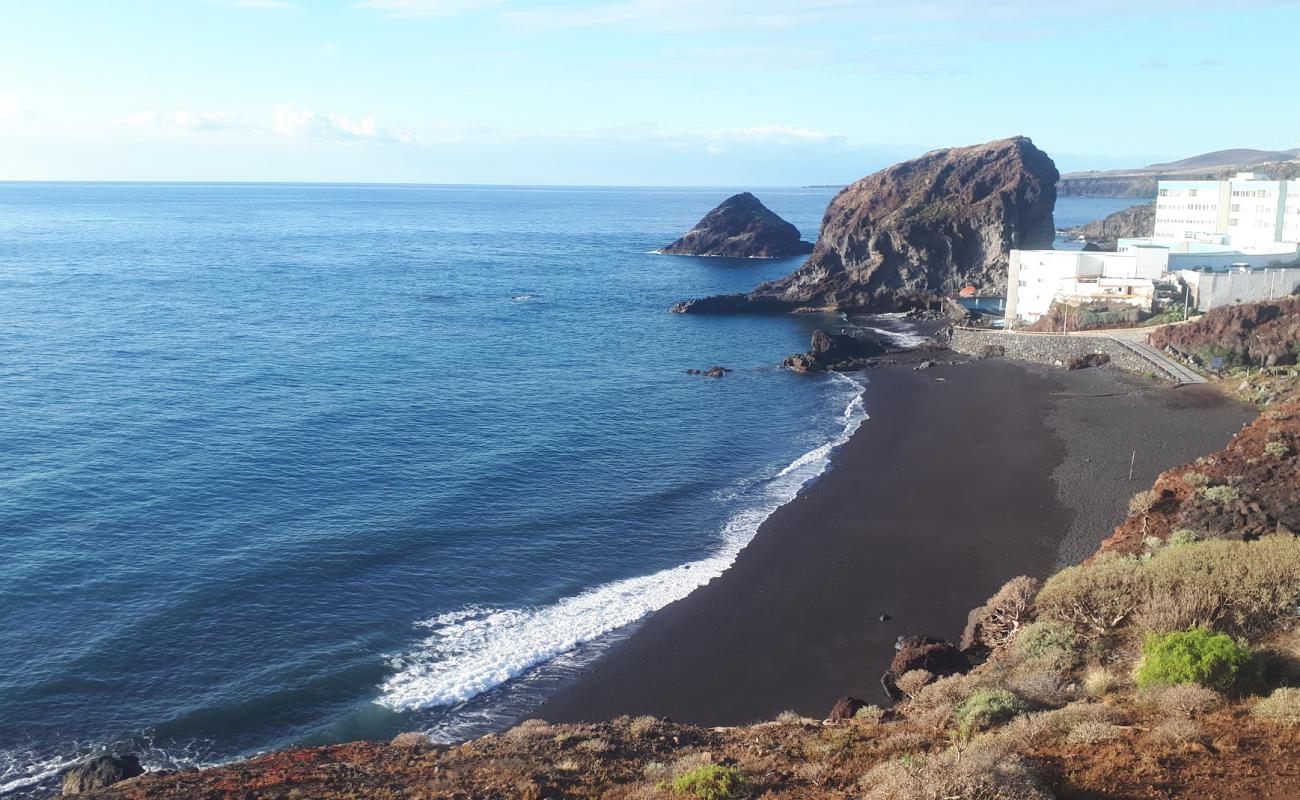 Photo de Playa del Abrigo avec sable gris de surface