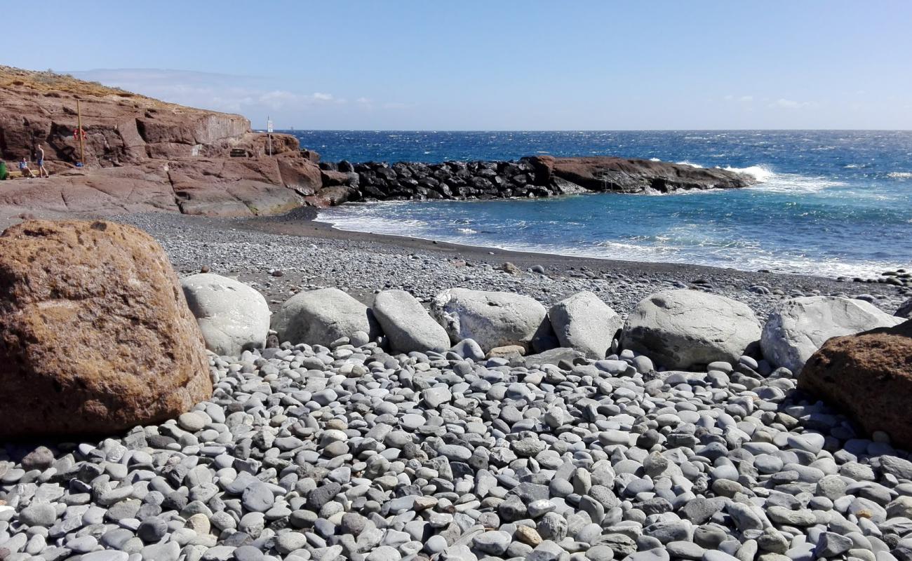 Photo de Playa del Rio avec sable brun de surface