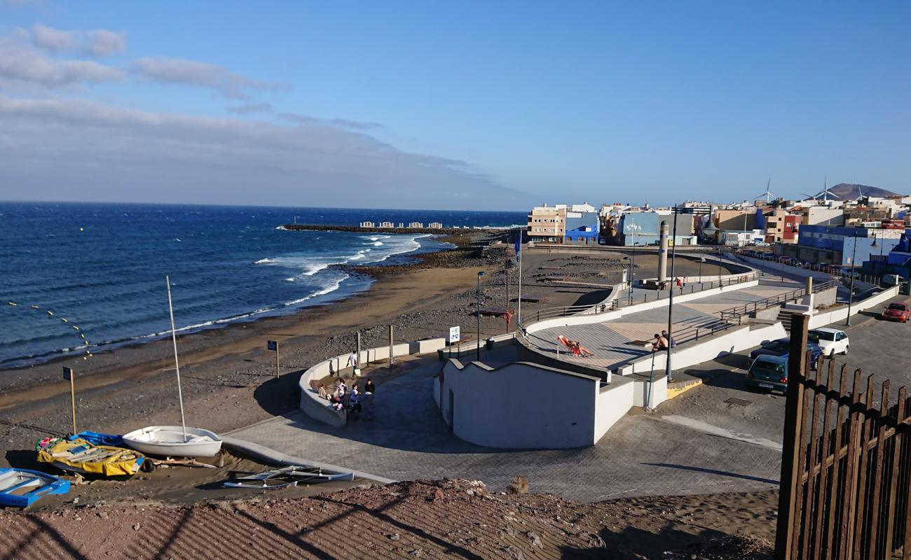 Photo de Playa El Burrero avec sable noir avec caillou de surface