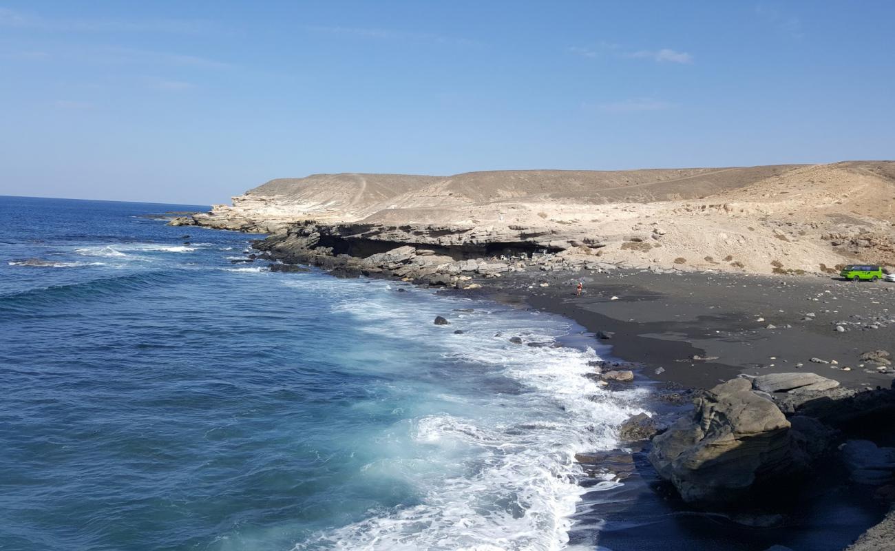 Photo de Playa Negras avec sable blanc avec roches de surface