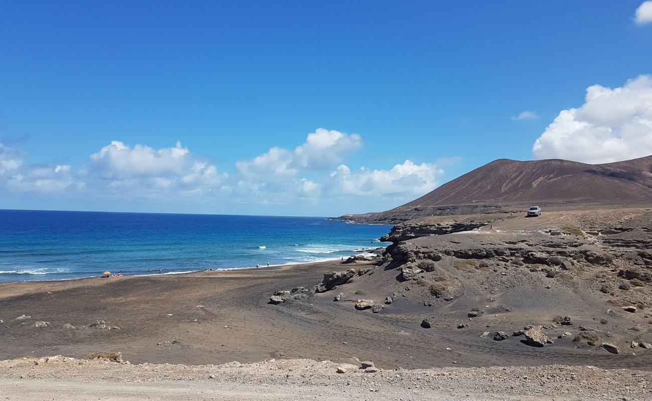 Photo de Playa de la Solapa avec sable brun de surface