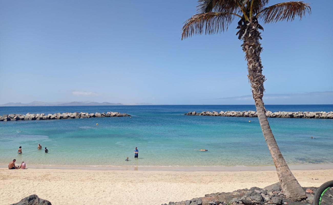 Photo de Plage Flamingo avec sable beige fin de surface