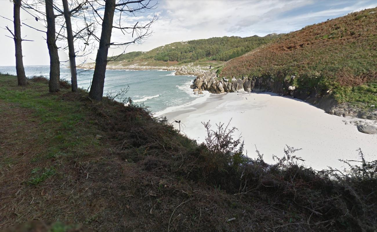 Photo de Praia de Porrido avec plusieurs petites baies