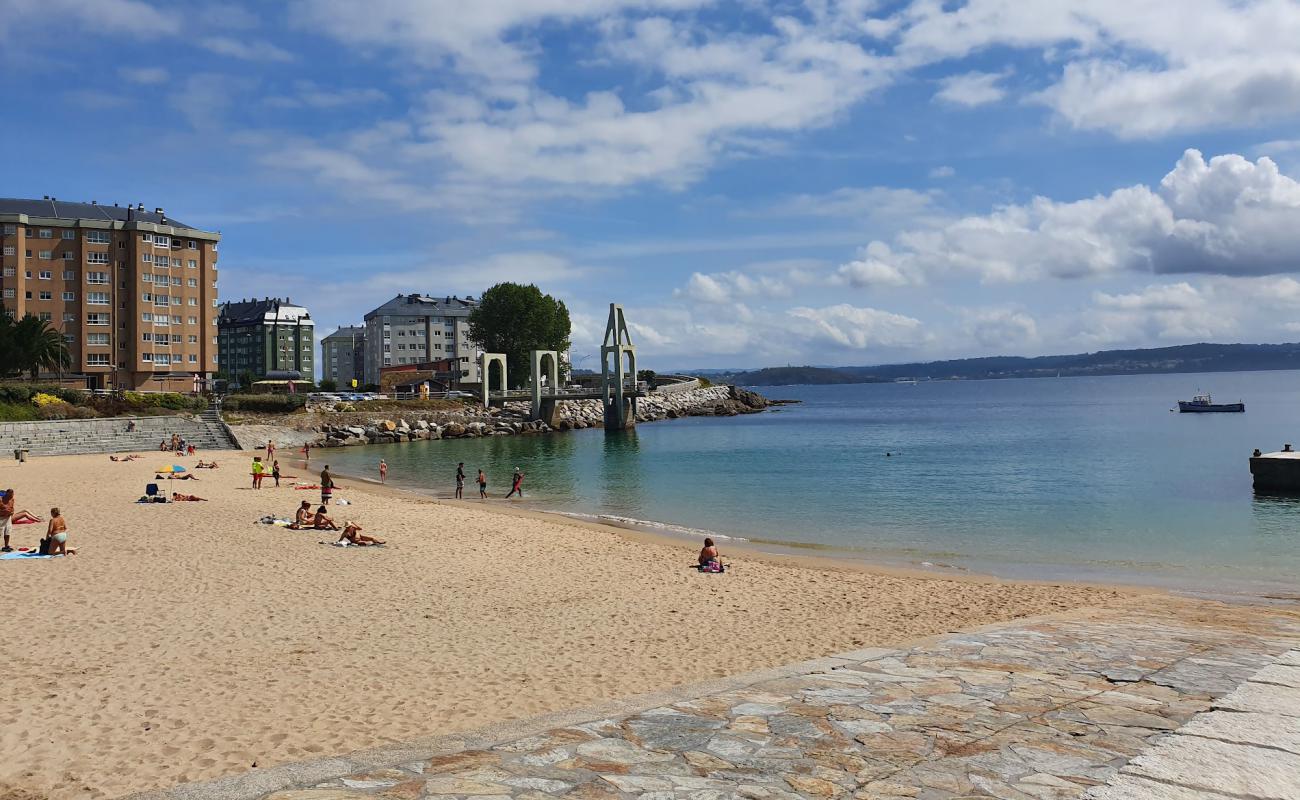 Photo de Praia de Adormideiras avec sable blanc de surface