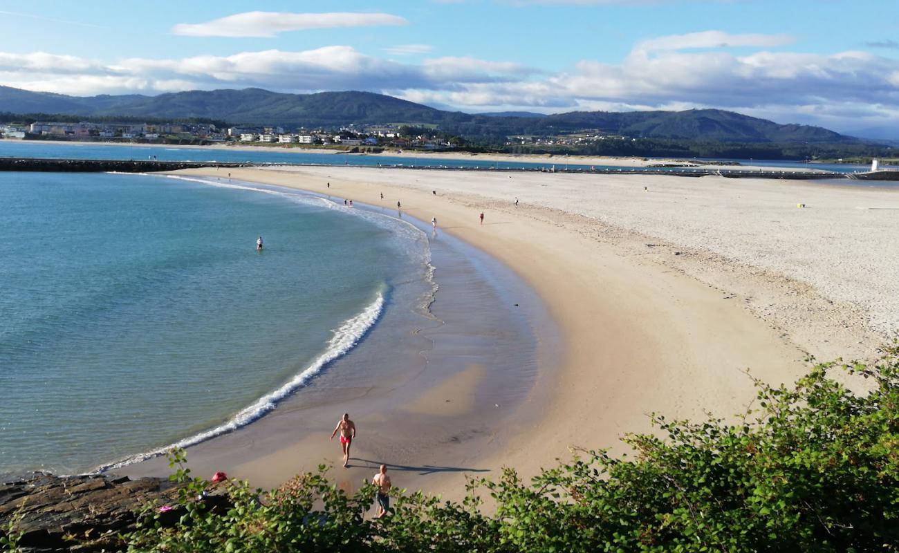 Photo de Praia da Rapadoira avec sable beige fin de surface