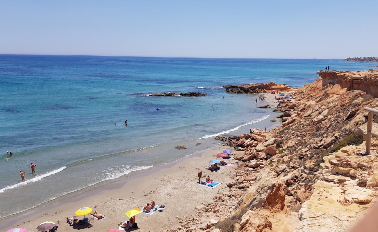 Photo de Cala La Mosca avec sable lumineux de surface