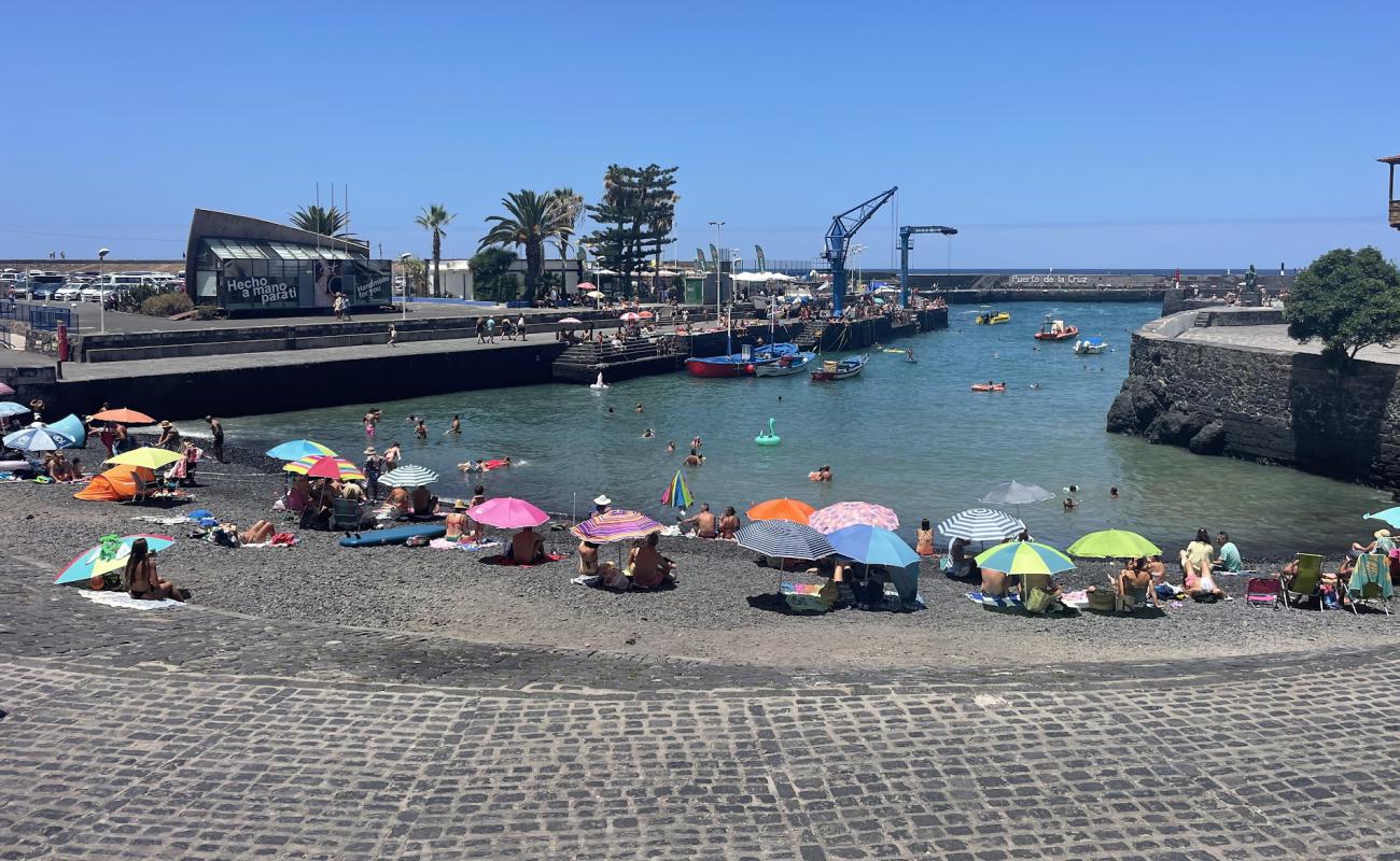 Photo de Playa del Muelle avec caillou gris de surface