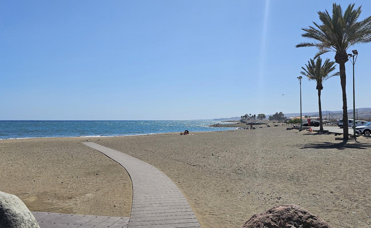 Photo de Playa La Caleta avec sable gris de surface
