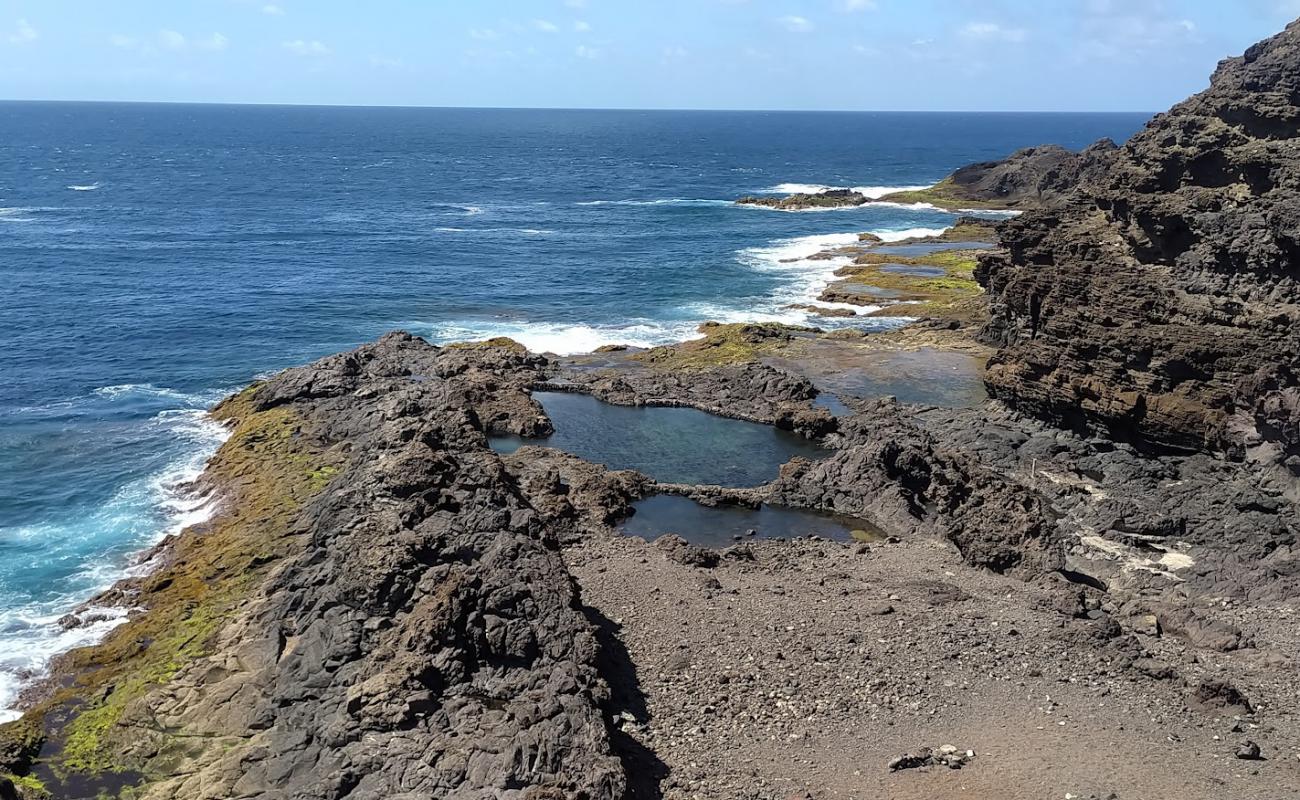 Photo de Playa Punta del Faro avec roches de surface