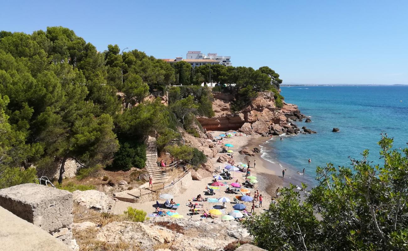 Photo de Cala Misteri avec sable beige de surface
