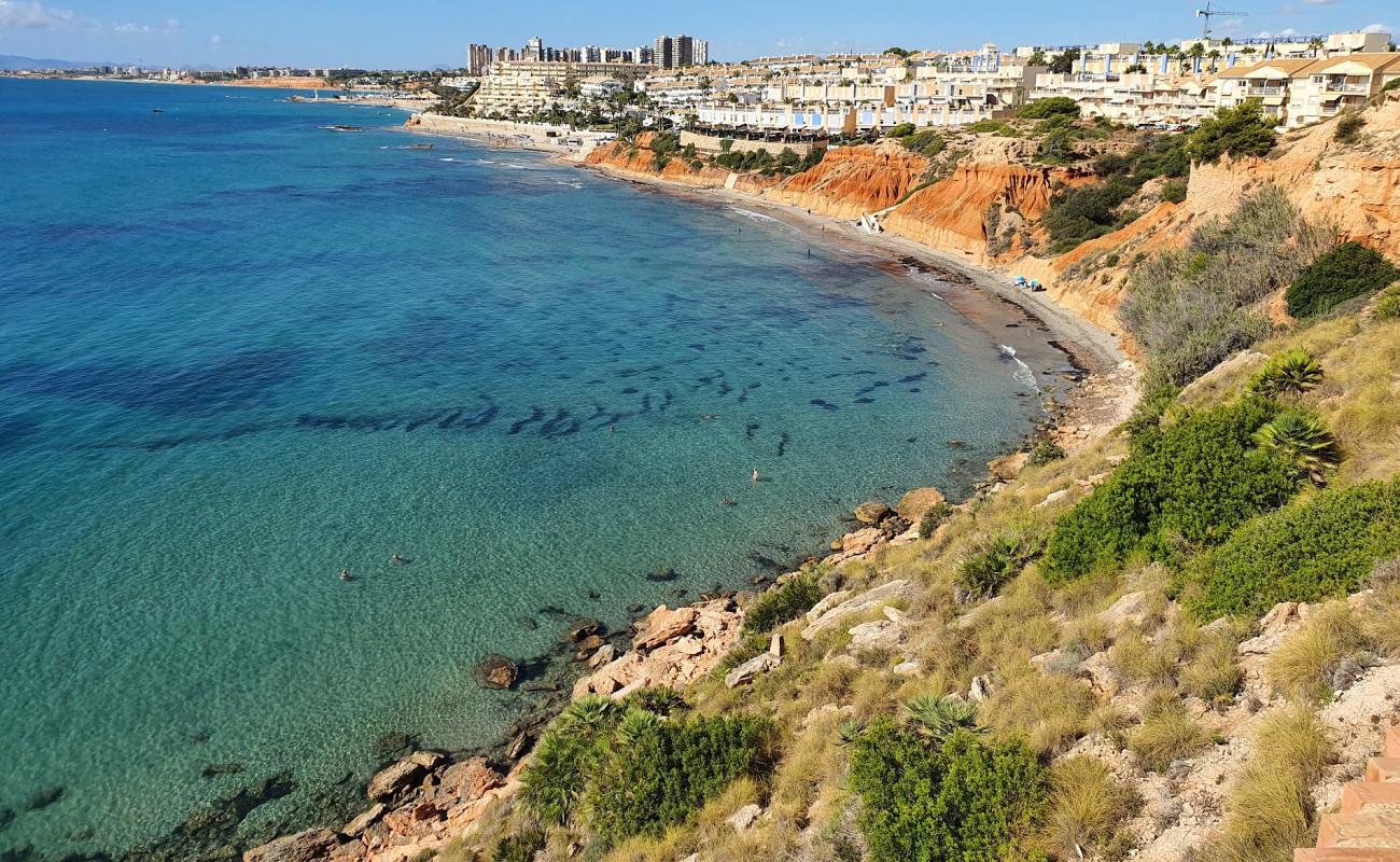 Photo de Cala Aguamarina avec sable gris de surface