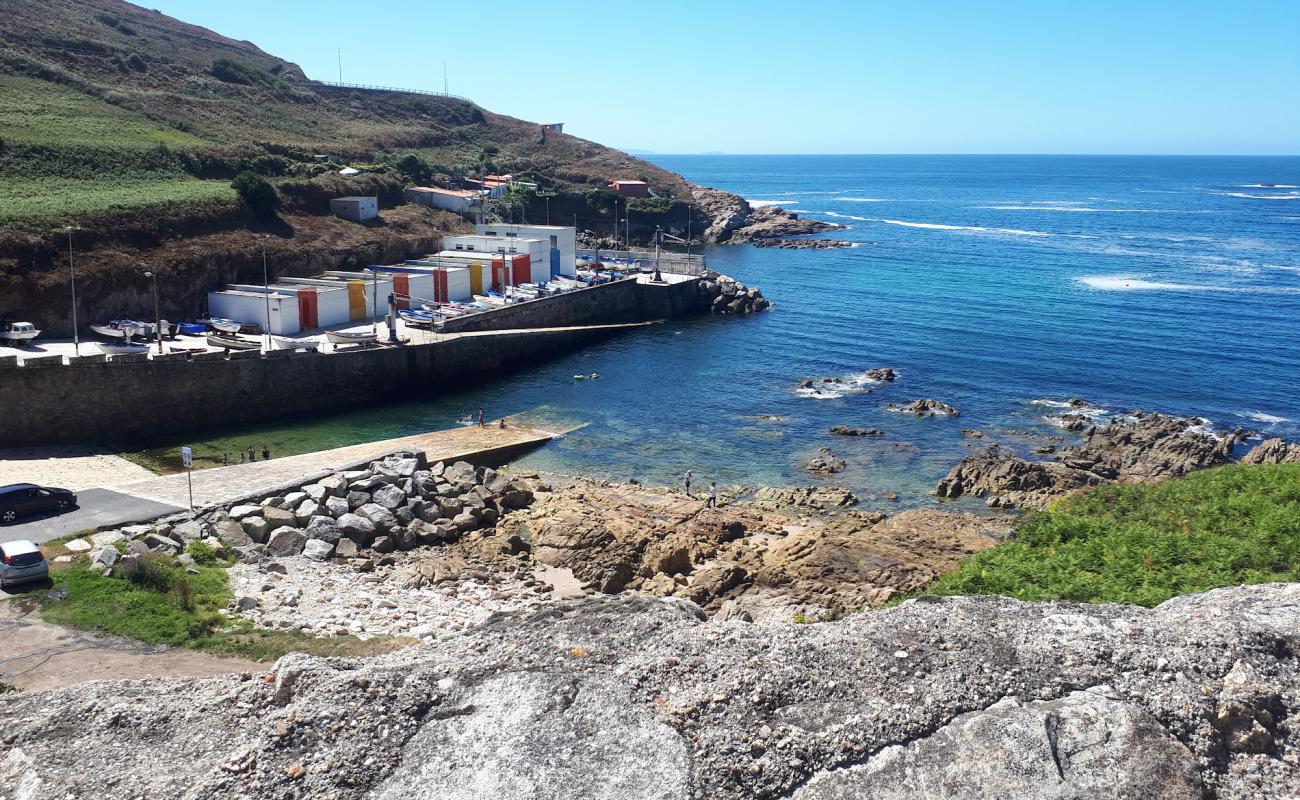 Photo de Cala do Portino avec sable beige de surface