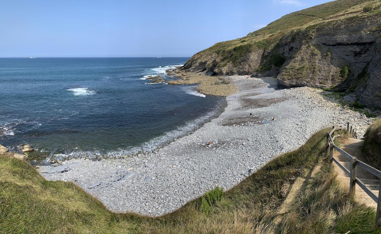 Photo de Playa del Lastron avec galets gris de surface