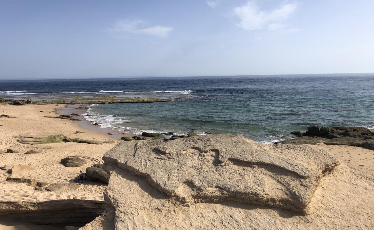 Photo de Playa del Faro avec sable lumineux de surface