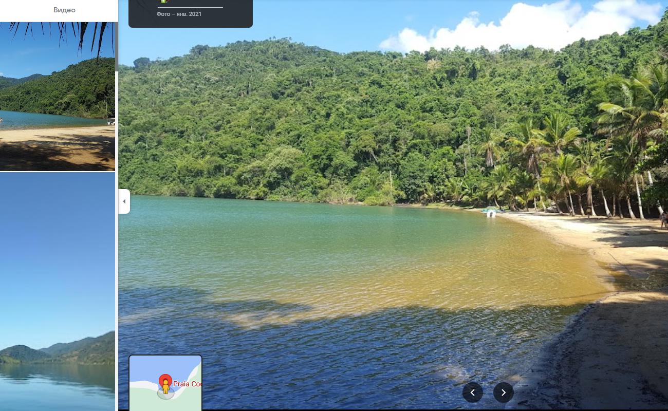 Photo de Praia Coqueiros avec sable lumineux de surface