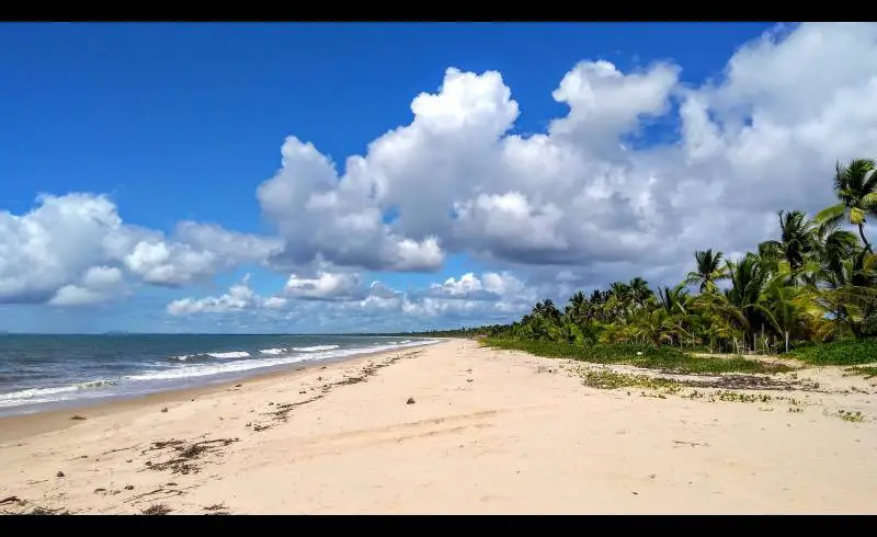 Photo de Praia de Pratigi avec sable lumineux de surface