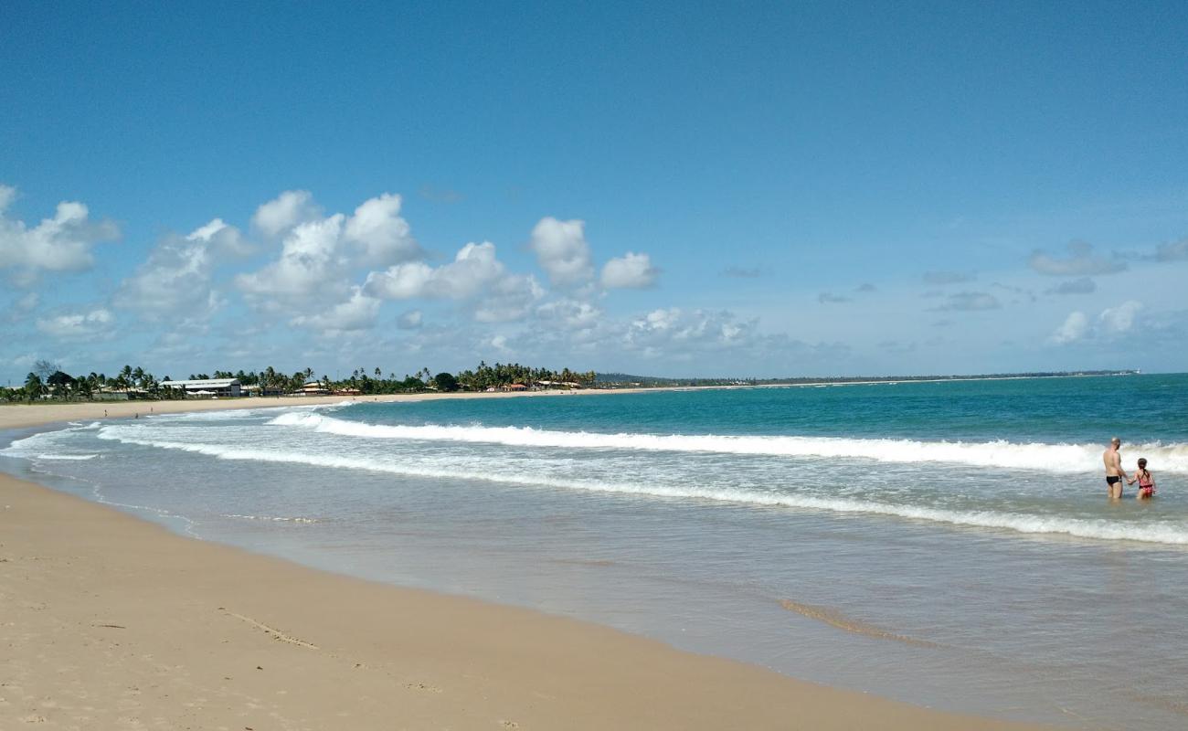 Photo de Praia de Itacimirim avec sable lumineux de surface