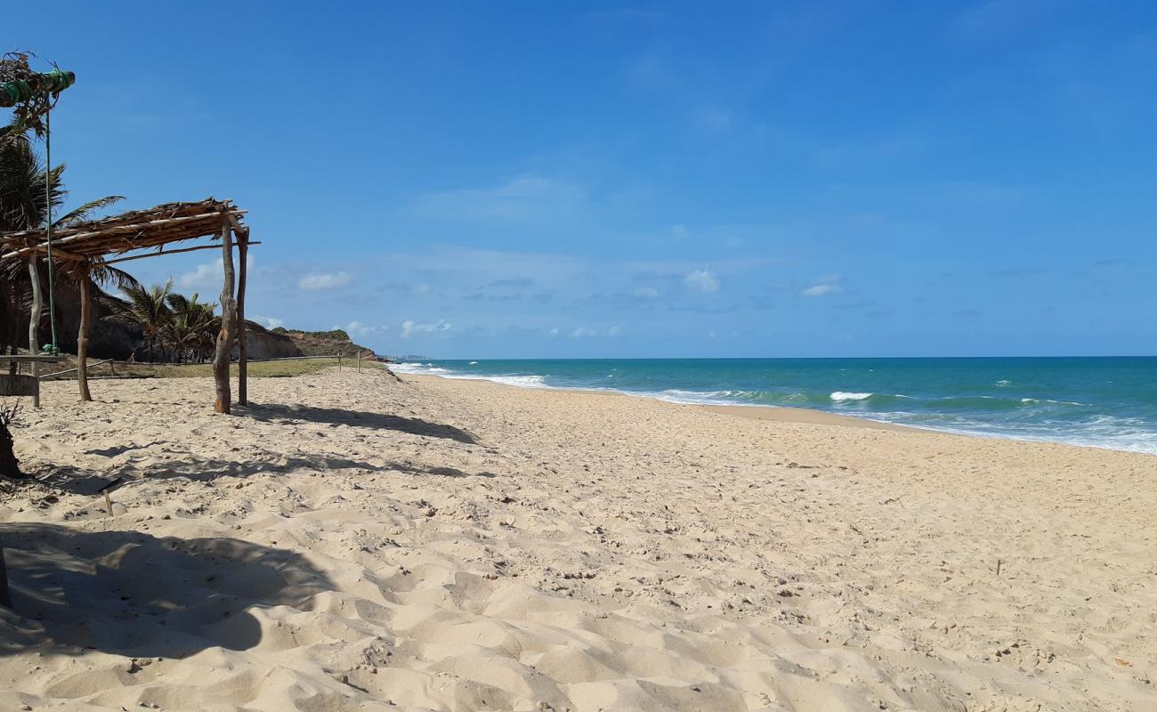 Photo de Plage de Tambá avec sable beige de surface
