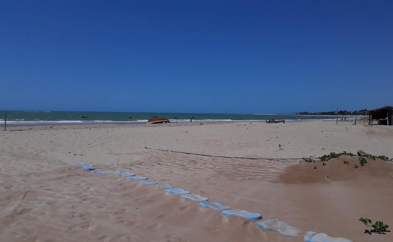 Photo de Praia de Coqueiro avec sable lumineux de surface