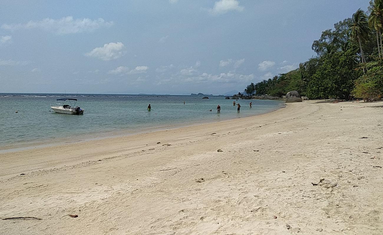 Photo de Natien Beach avec sable beige de surface