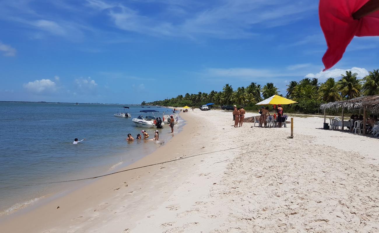 Photo de Praia de Mangue Seco avec sable beige de surface