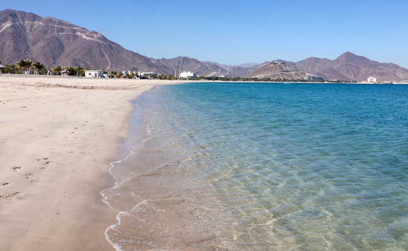 Photo de Umbrella Beach avec sable beige de surface