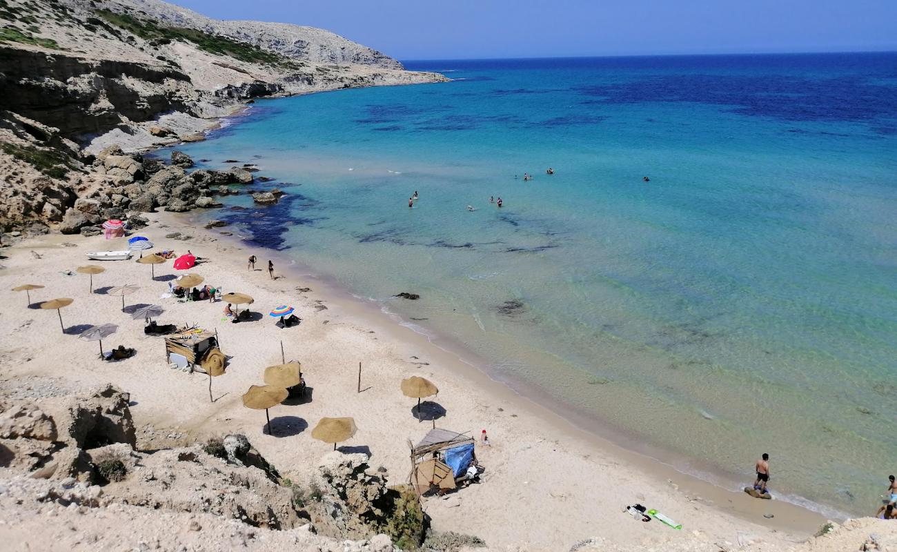 Photo de La Grotte beach avec sable fin et lumineux de surface