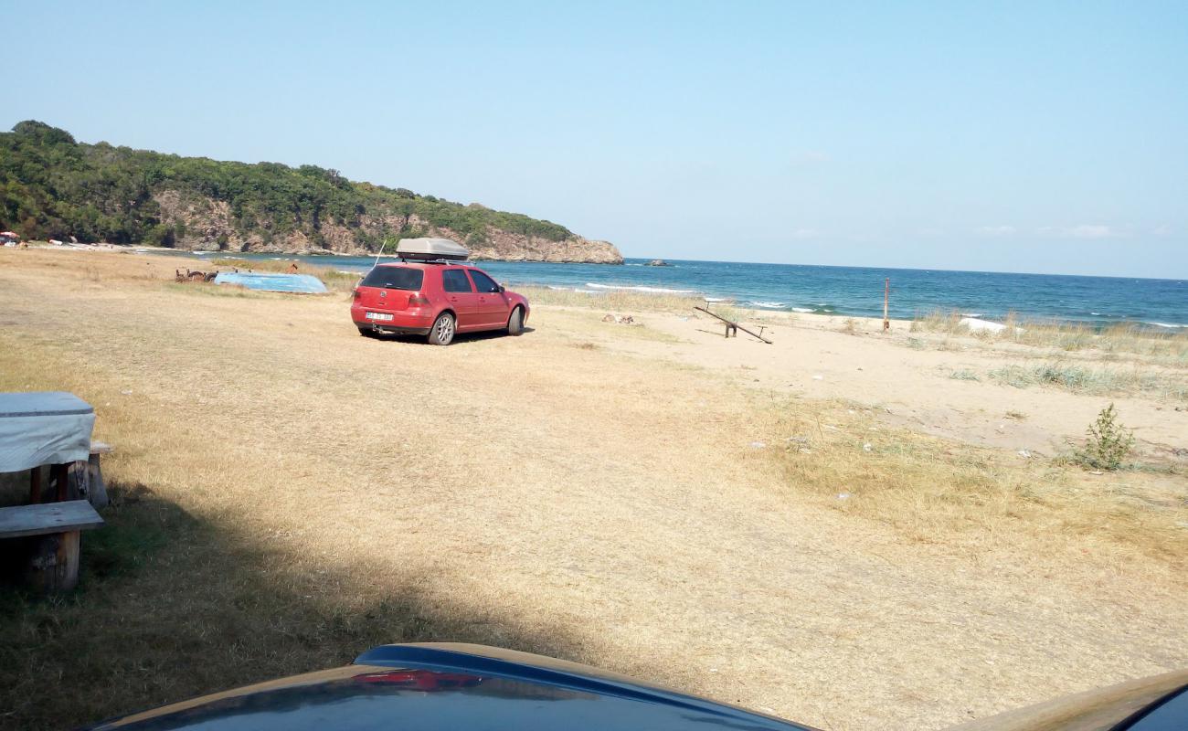 Photo de Police beach avec sable beige de surface
