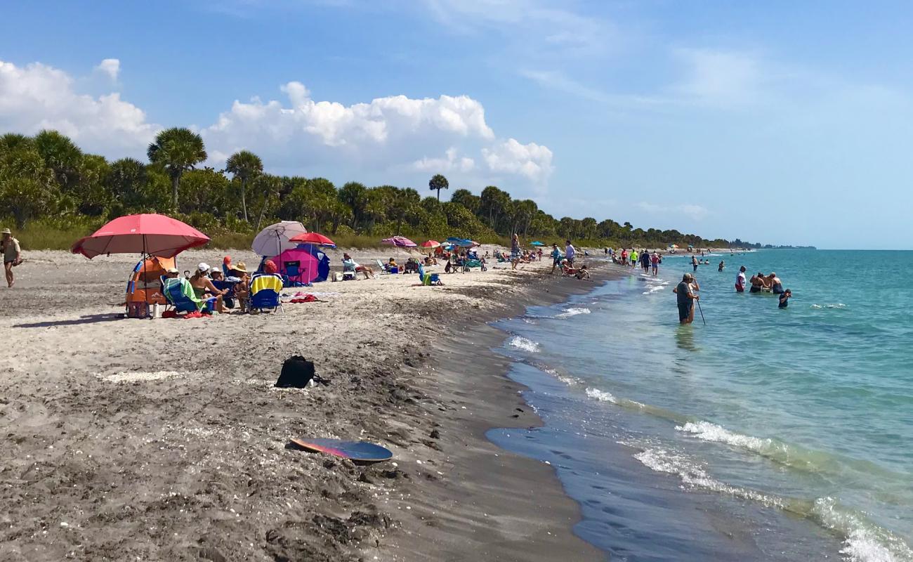 Photo de Caspersen beach avec sable gris avec roches de surface