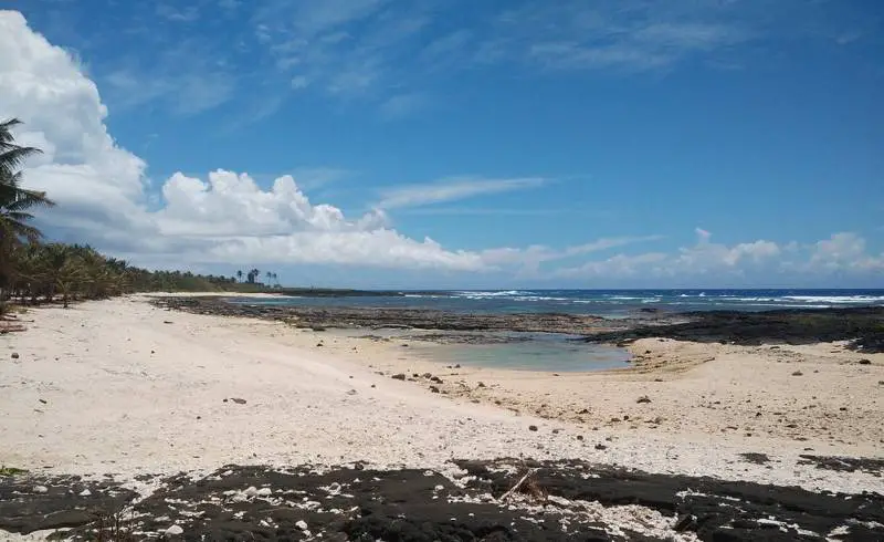 Photo de Cape Vaitoloa avec sable beige de surface