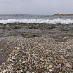 Photo de Turkler beach IV avec l'eau bleu-vert de surface